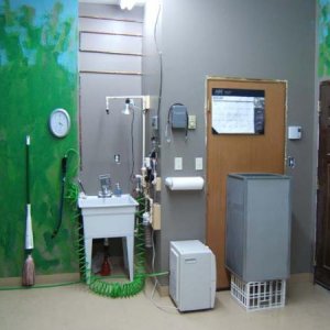cham room shower stall, wash basin, dehumidifier, mop, and door to feeder room.