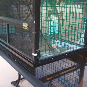 Right side of cage stand open for drain pan to slide in and out
