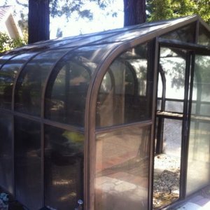 I bought this 4-seasons hobby greenhouse/sunroom for a bargain on Craigslist.

This is the actual photo from the ad.

The only catch was that I ne