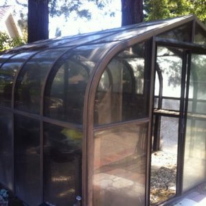 I bought this 4-seasons hobby greenhouse/sunroom for a bargain on Craigslist.

This is the actual photo from the ad.

The only catch was that I ne