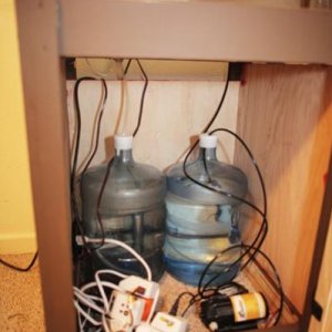 inside-contents
(From left to right.)
Drain/waste water reservoir, fresh water reservoir, timers and mist king pump.