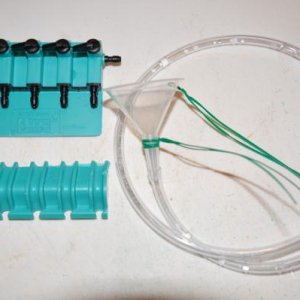 Close-up shot of the funnel and gang valve solution.  I cut the overhang lip portion of the gange valve off with a hack saw so the gange valve could b